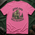 Bigfoot Stop and Smell the Flowers T-Shirt — Sasquatch Holding Daisies Retro Nature Tee