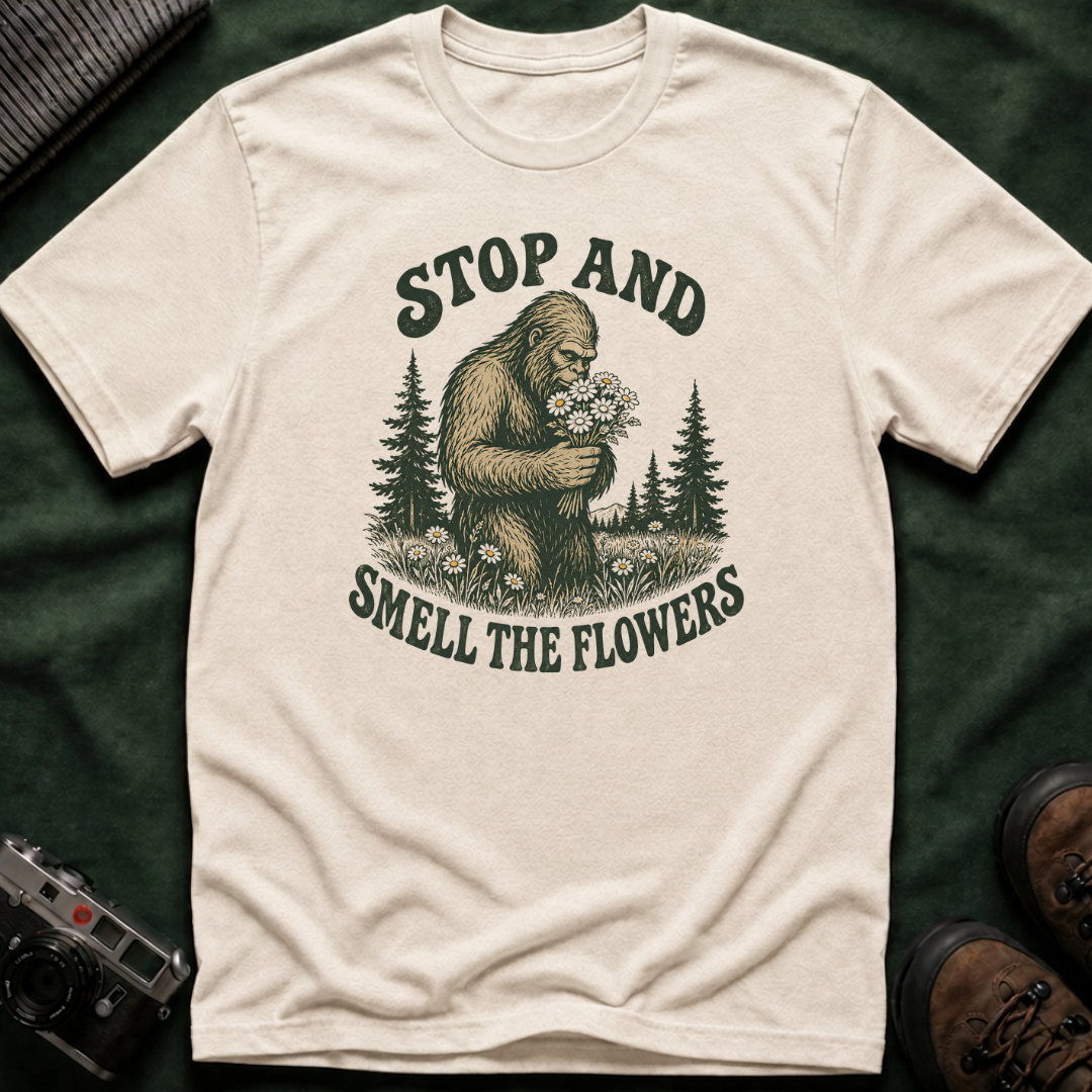 Bigfoot Stop and Smell the Flowers T-Shirt — Sasquatch Holding Daisies Retro Nature Tee