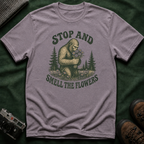 Bigfoot Stop and Smell the Flowers T-Shirt — Sasquatch Holding Daisies Retro Nature Tee